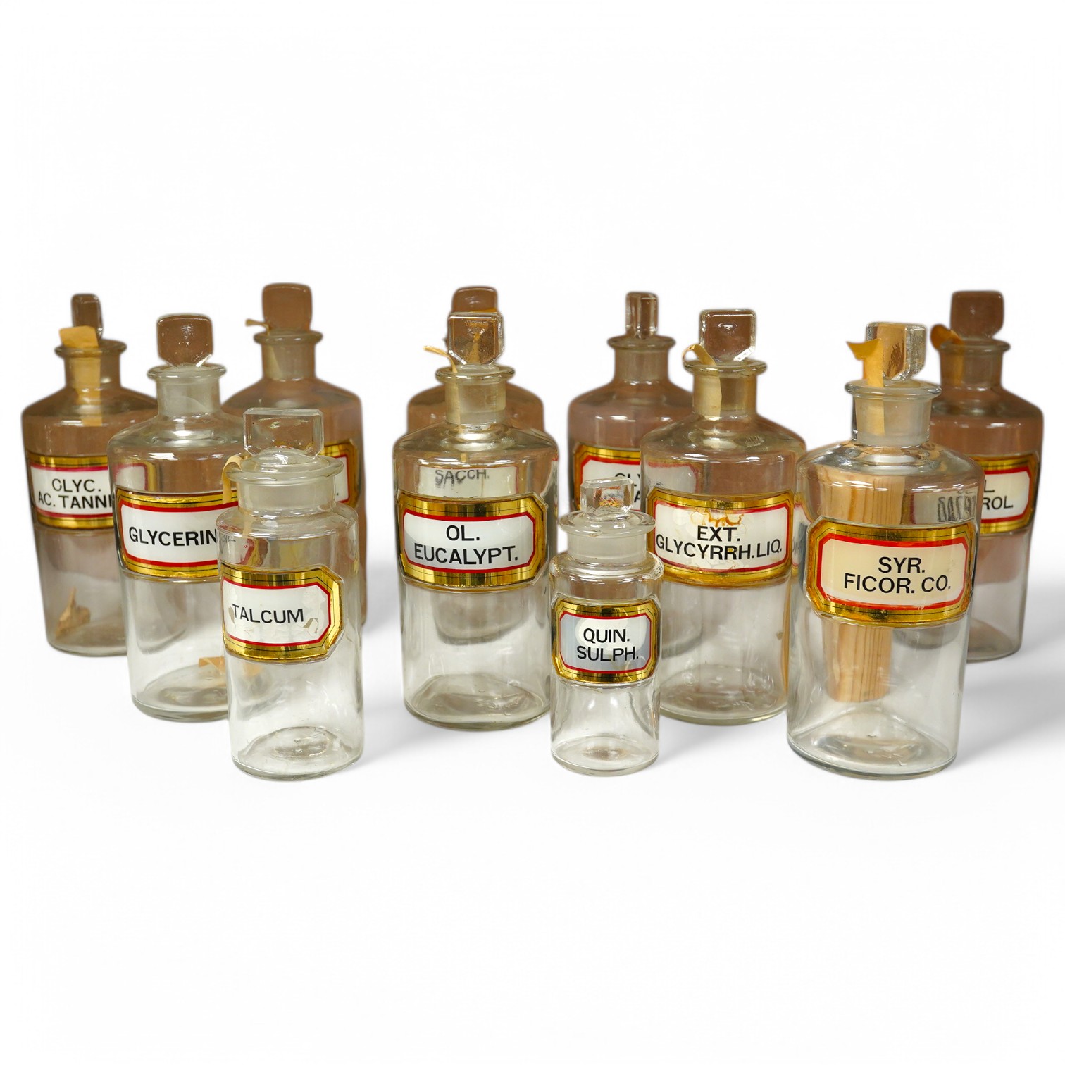 A collection of eleven various sized apothecary labelled bottles, tallest 20cm high. Condition - good